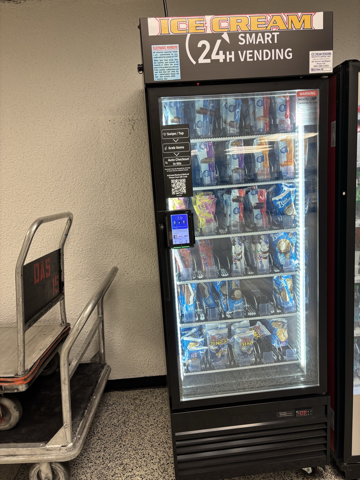 AI smart cooler stocked with fresh food and beverages in a modern office lobby